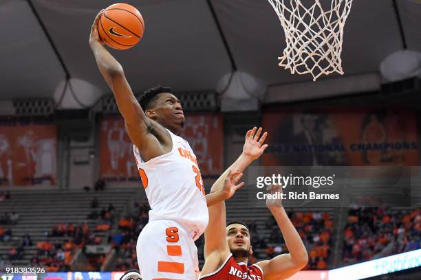 tyus-battle-of-the-syracuse-orange-drives-to-the-basket-for-a-dunk-over-omer-yurtseven-of-the.jpg
