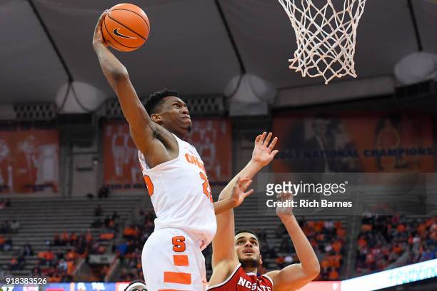 tyus-battle-of-the-syracuse-orange-drives-to-the-basket-for-a-dunk-over-omer-yurtseven-of-the.jpg